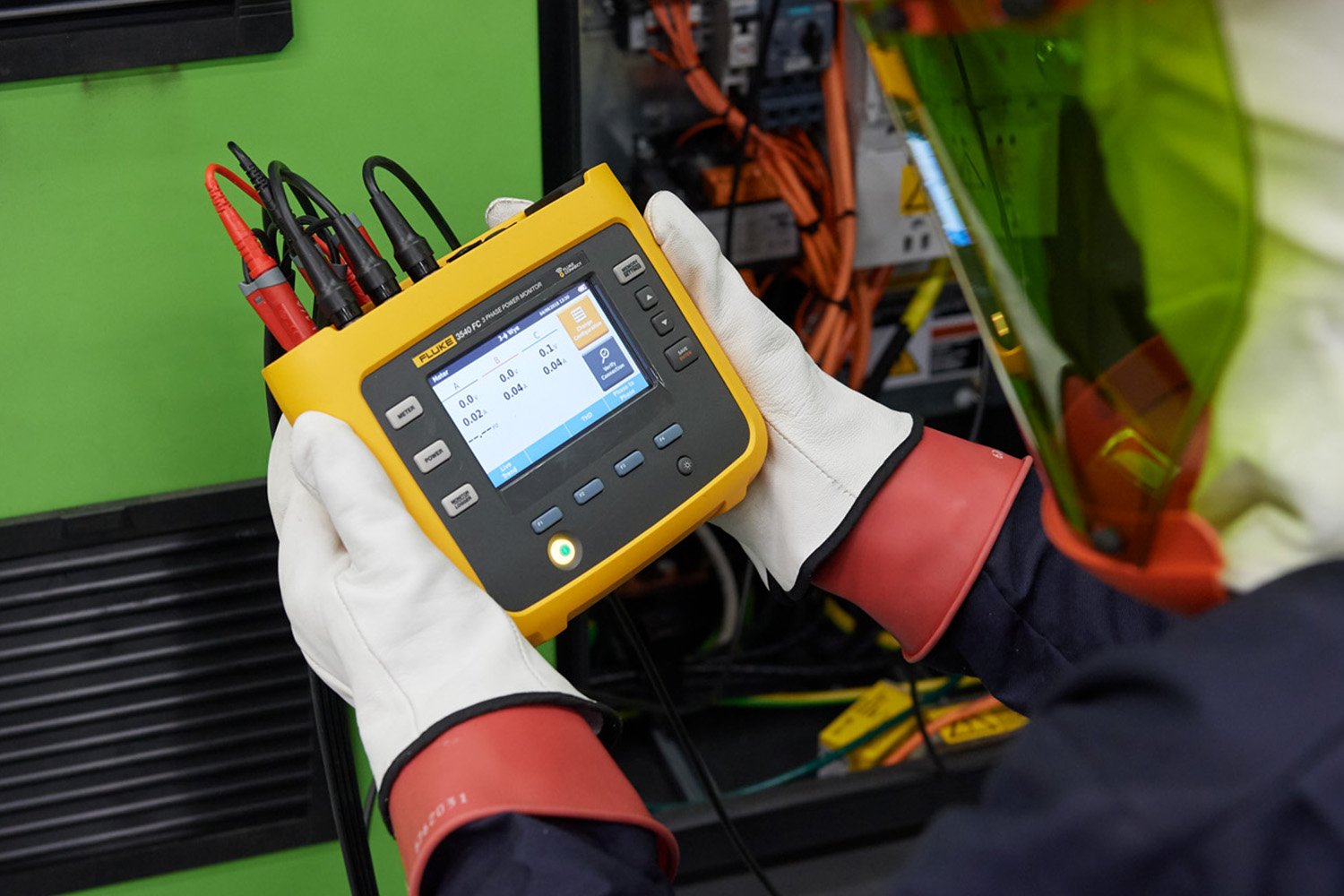 A clickable image of the Fluke 3540 FC Three-Phase Power Monitor in use. Leads to the power monitoring page.