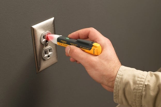 Fluke Non-contact Voltage Tester Detecting Voltage at an Electrical Outlet